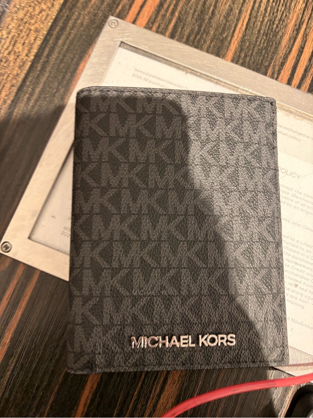 Michael Kors Black Signature MK Passport Wallet with Silver Logo